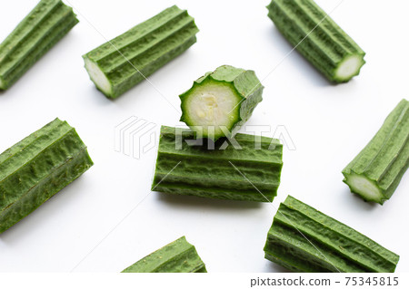 Fresh luffa vegetables on white background. Fresh luffa vegetables on white background. 75345815