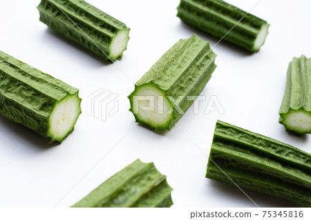 Fresh luffa vegetables on white background. Fresh luffa vegetables on white background. 75345816