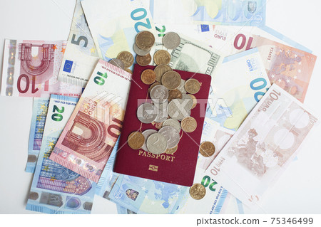 Cash on table isolated: dollars, euro, rubl broken money. All in mess, global crisis . passport travel concept Cash on table isolated: dollars, euro, rubl broken money. All in mess, global crisis . passport travel concept 75346499