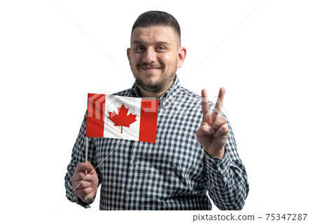 White guy holding a flag of Canada and shows two fingers isolated on a white background 75347287