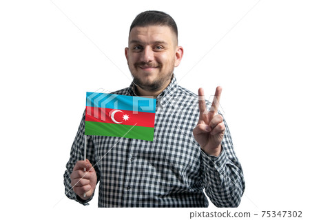 White guy holding a flag of Azerbaijan and shows two fingers isolated on a white background White guy holding a flag of Azerbaijan and shows two fingers isolated on a white background 75347302