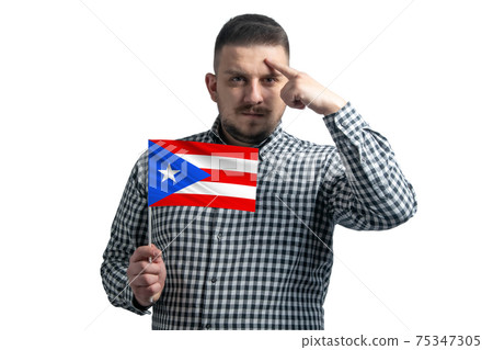 White guy holding a flag of Puerto Rico and a finger touches the temple on the head isolated on a white background White guy holding a flag of Puerto Rico and a finger touches the temple on the head isolated on a white background 75347305