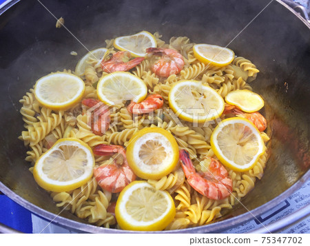 Finished paella pasta cooked outdoors Finished paella pasta cooked outdoors 75347702