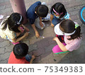 Young children gather and play ticket 75349383