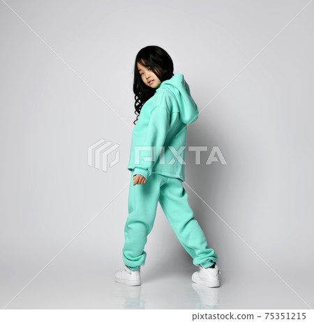 Pretty asian kid girl in pastel green, mint color Pretty asian kid girl in pastel green, mint color 75351215