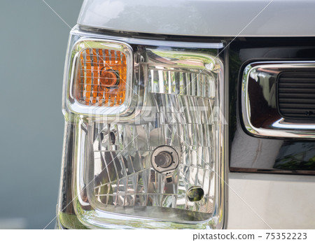 Vehicles front head lamp close up photo. Vehicles front head lamp close up photo. 75352223