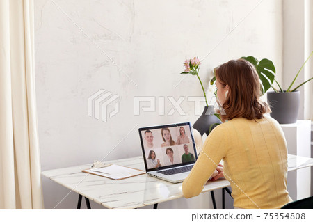 Woman speak using Webcam conference on laptop Woman speak using Webcam conference on laptop 75354808