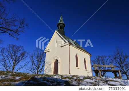 Beautiful winter landscape with church. Sunny winter day. Brno - Lisen. Chapel of Our Lady of Helper. 75355091