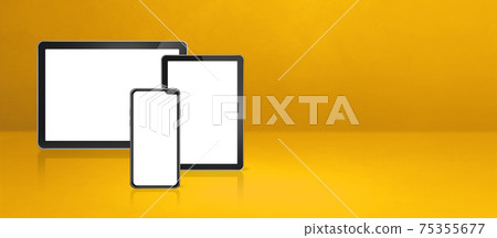 Mobile phone and digital tablet pc on yellow office desk. Background banner 75355677