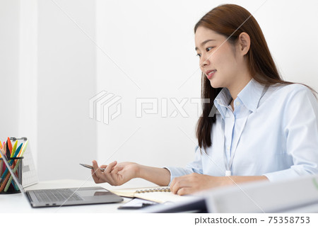 Financial or accounting professionals use a computer to analyze the company's revenue-expenses graph to prepare for presentation to the chief executive and partner 75358753