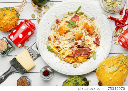 Autumn pasta with pumpkin and bacon 75359070