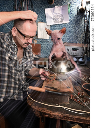 Male amateur radio operator tries to fix a UFO of aliens hairless cats 75360534