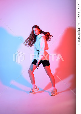 Teenage female dancing hip-hop in studio, casual clothes 75360627