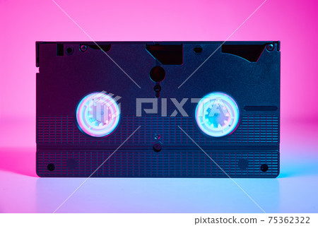 Video cassete on the color background. Retro vhs cassette tape Video cassete on the color background. Retro vhs cassette tape 75362322