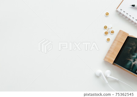 Office work, education flat lay concept with phone, headphones, white background Office work, education flat lay concept with phone, headphones, white background 75362545