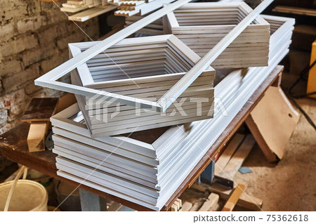 Stacked door moldings made of MDF in workshop 75362618