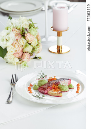 Tender dorado fillet with vegetables and basil. Banquet festive dishes. Gourmet restaurant menu. White background. 75363529