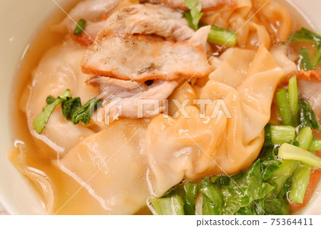 Chinese dumpling topping slice red barbrcue pork with clear soup on bowl Chinese dumpling topping slice red barbrcue pork with clear soup on bowl 75364411