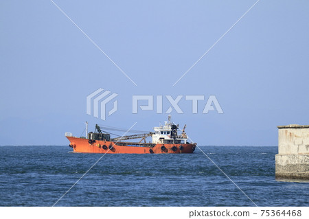 Cargo ship leaving Oiketa City Miike Port, 75364468