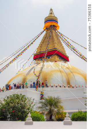 Bodhnath stupa in kathmandu with buddha eyes and prayer flags Bodhnath stupa in kathmandu with buddha eyes and prayer flags 75366358