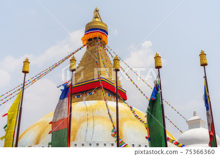Bodhnath stupa in kathmandu with buddha eyes and prayer flags Bodhnath stupa in kathmandu with buddha eyes and prayer flags 75366360