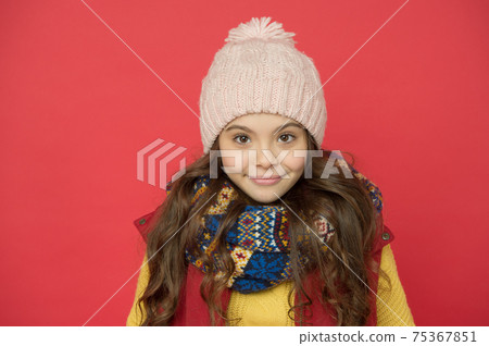childhood happiness. winter holiday activity. child in knitted childhood happiness. winter holiday activity. child in knitted 75367851