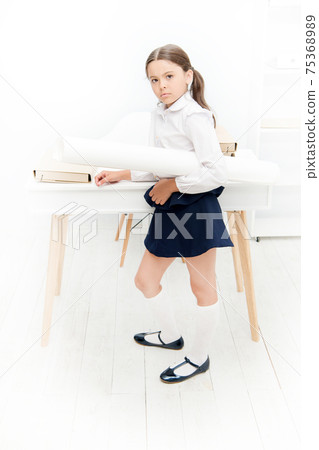 Serious about own project. Girl hold whatman paper. Kid Serious about own project. Girl hold whatman paper. Kid 75368989