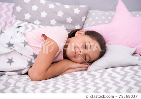 Girl child fall asleep on pillow. Quality of sleep depends Girl child fall asleep on pillow. Quality of sleep depends 75369037