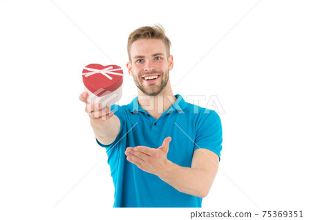 Happy man hold heart shaped valentine box. Guy smile 75369351