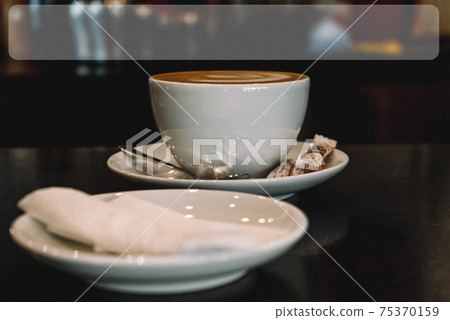 Mug with a saucer, latte, three bags of sugar, spoon, with film grain Mug with a saucer, latte, three bags of sugar, spoon, with film grain 75370159