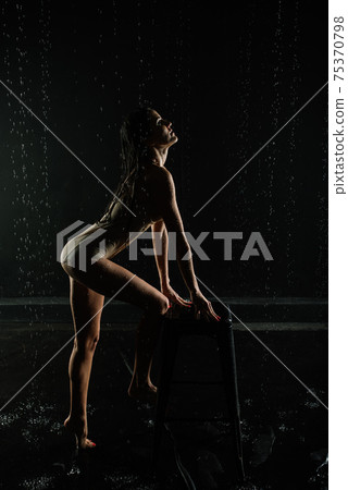 Young sexy woman posing in water studio. Young sexy woman posing in water studio. 75370798