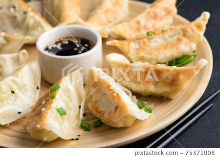 Fried chinese dumplings Gyoza 75371008