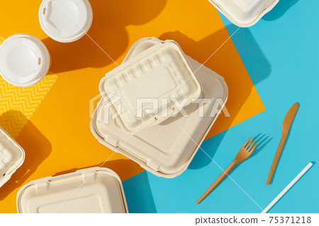 Lunchboxes on colorful table. Food delivery concept. Lunchboxes on colorful table. Food delivery concept. 75371218