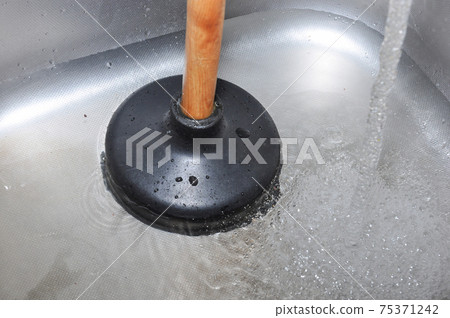 Plunger and kitchen sink. Plunger and kitchen sink. 75371242