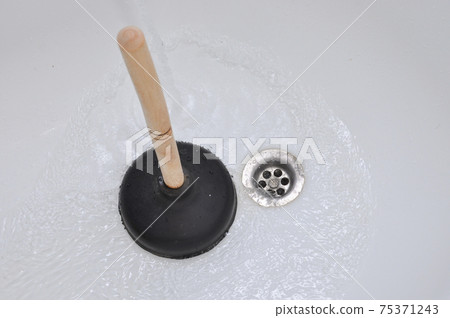 Plunger and clogged bath. Cleaning concept. Plunger and clogged bath. Cleaning concept. 75371243