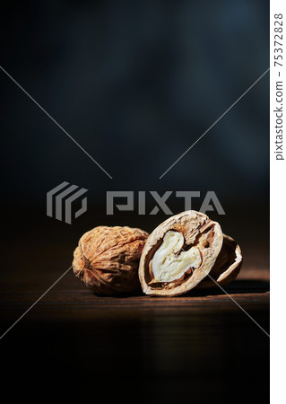 Hazelnuts on a black background black frexh Hazelnuts on a black background black frexh 75372828