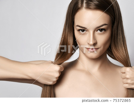 Portrait of young beautiful woman with silky long 75372865