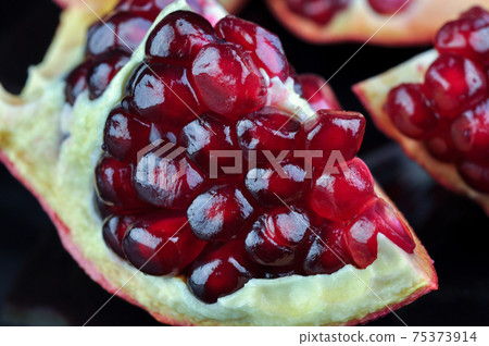 Pomegranates seeds close up. 75373914