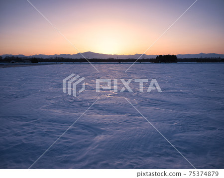 Snowfield and sunset Snowfield and sunset 75374879