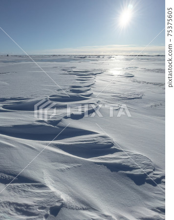 Ice slopes in sunny winter day, transparent ice of blue color, purely blue sky, long shadows, a pure snow-covered virgin soil, snow barkhans, Ice slopes in sunny winter day, transparent ice of blue color, purely blue sky, long shadows, a pure snow-covered virgin soil, snow barkhans, 75375605