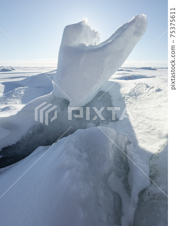 Ice slopes in sunny winter day, transparent ice of blue color, purely blue sky, long shadows, a pure snow-covered virgin soil, snow barkhans, Ice slopes in sunny winter day, transparent ice of blue color, purely blue sky, long shadows, a pure snow-covered virgin soil, snow barkhans, 75375611