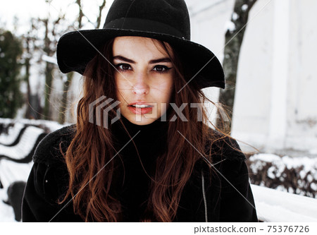 young pretty teenage hipster girl outdoor in winter snow park having fun drinking coffee, warming up happy smiling, lifestyle people concept young pretty teenage hipster girl outdoor in winter snow park having fun drinking coffee, warming up happy smiling, lifestyle people concept 75376726