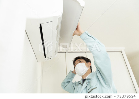 Workers inspecting air conditioners Workers inspecting air conditioners 75379554