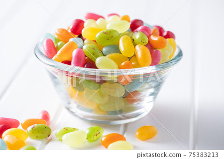 Sweet colorful jelly beans in bowl. 75383213