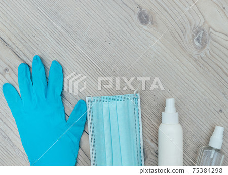 personal protective equipment on a wooden background personal protective equipment on a wooden background 75384298