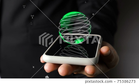 Human hand holding mobile phone with earth globe holographic technology 75386273