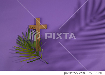 Palm sunday background. Cross and palm on purple background. Palm sunday background. Cross and palm on purple background. 75387191