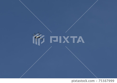 Quadrocopter on a background of blue sky. Quadrocopter on a background of blue sky. 75387999
