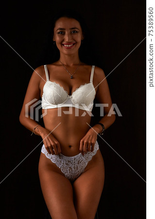 Art nude. Perfect body, sexy girl on smiling the dark background 75389560