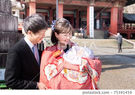 A happy family of three who came to visit the shrine A happy family of three who came to visit the shrine 75391459